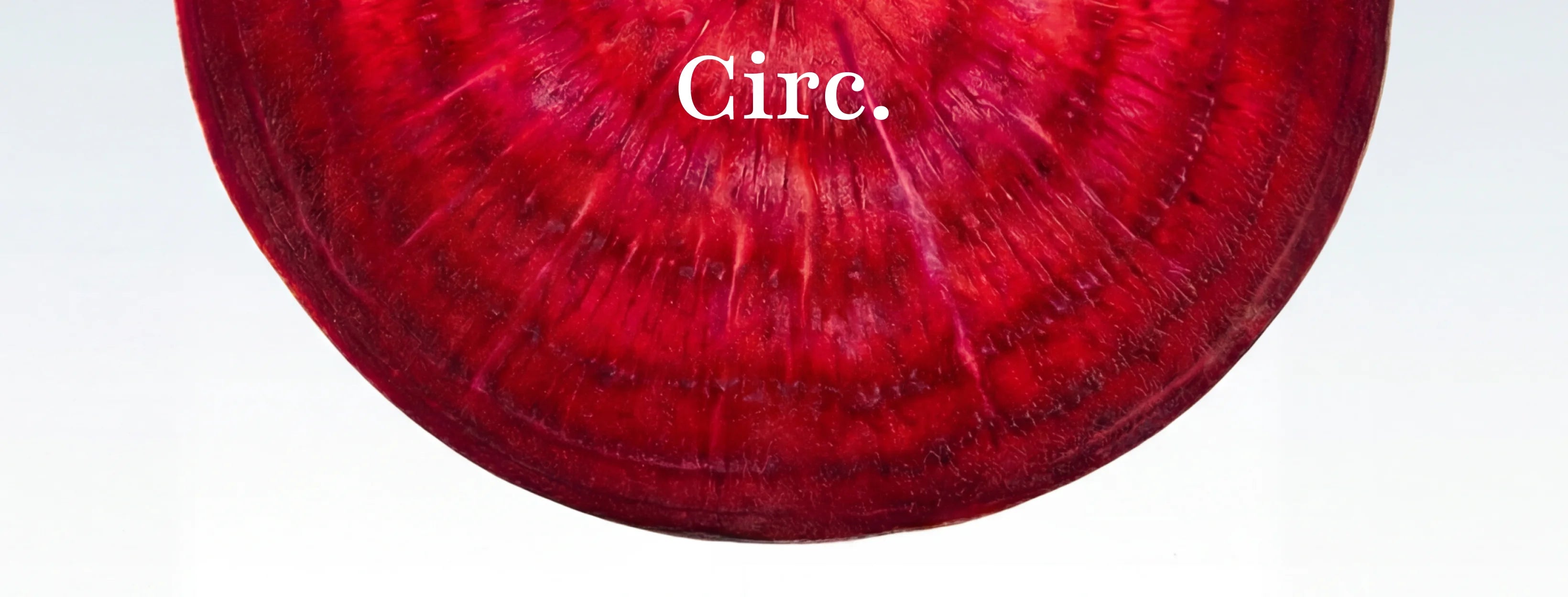 Close-up of a red beet with 'Circ.' text on a white background